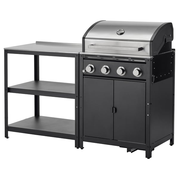 GRILLSKÄR gasgrill i rustfrit stål med sorte hylder til udendørs madlavning.