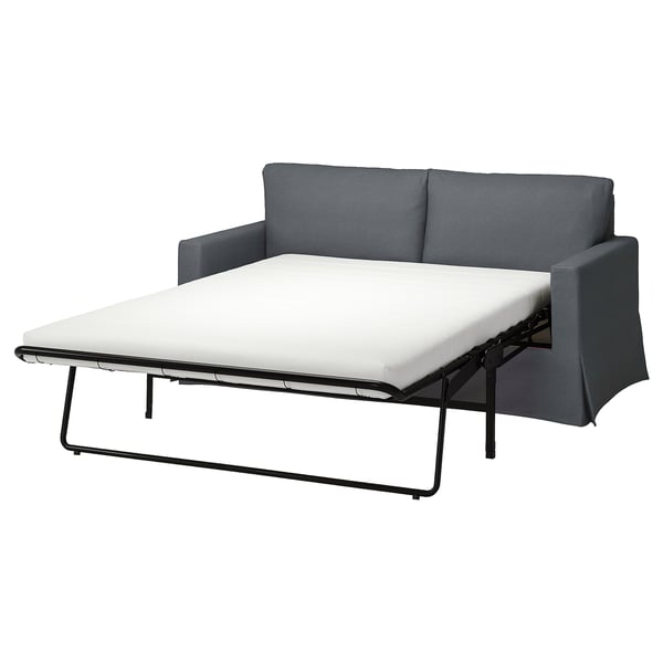 Grå sovesofa med minimalistisk design, med et rent look og behagelige hynder.