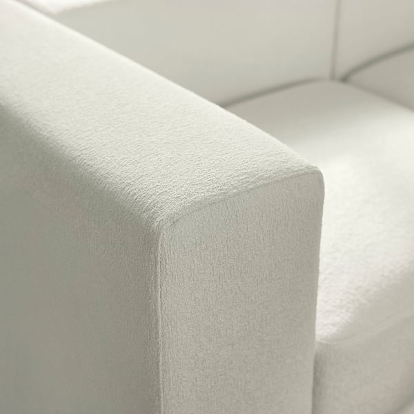 Nærbillede af blødt, højkvalitets sofapolstring, der viser glat tekstur og fine syninger.