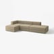 Moderne beige l-formet sektionsofa med justerbare moduler.