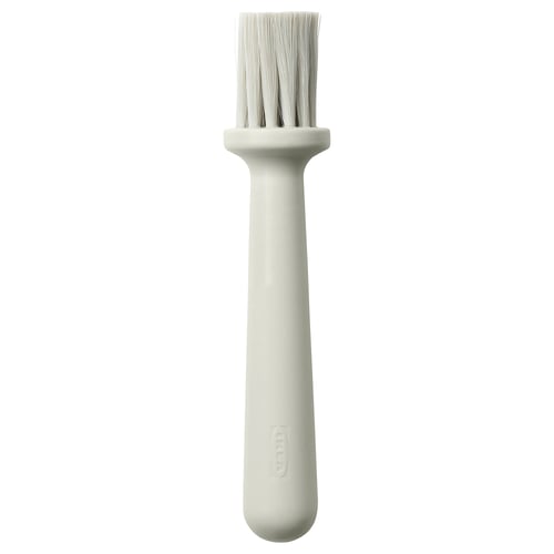 Viser en hvid LÄTTBAKAD wienerbrødsbørste med nylonbørster og et plastikhåndtag fra ikea.