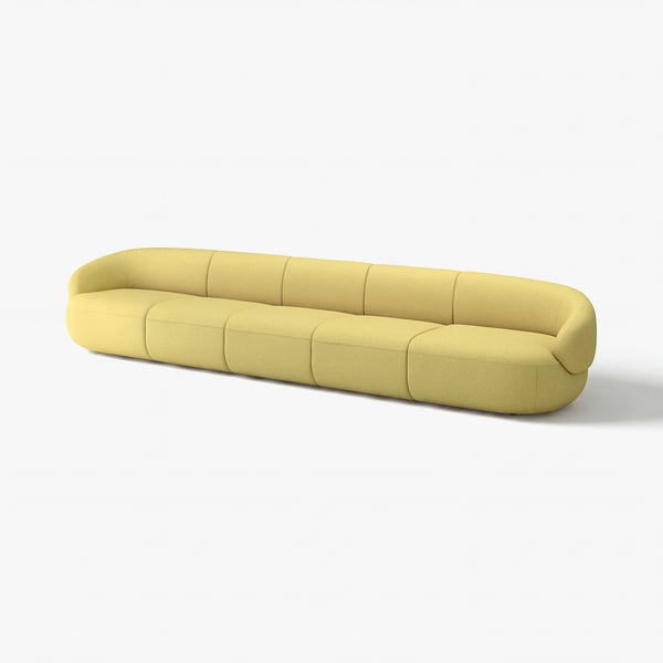 Moderne limegrøn sofa med bløde kurver og en legende stil.