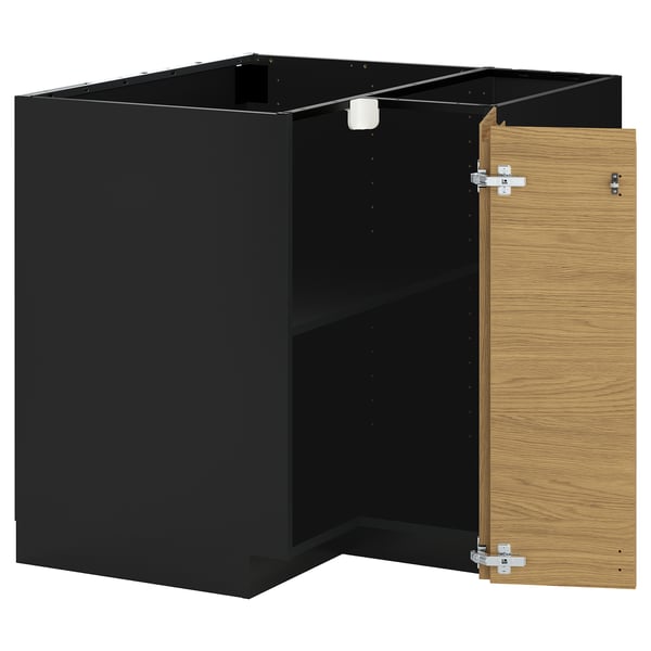 En ikea METOD køkkenenhed i sort og egetræ med åben låge.