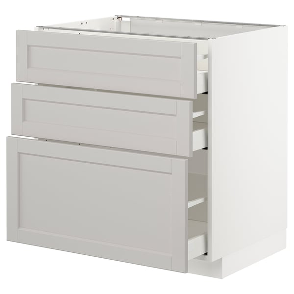 Moderne hvid køkkenenhed med tre skuffer, lysegrå, fasede kanter, robust design.
