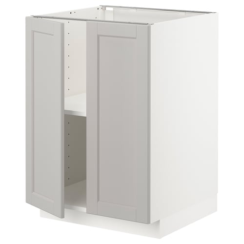 Et hvidt METOD underskab med åben låge, med et lysegråt lerhyttan-design med skrå kanter.