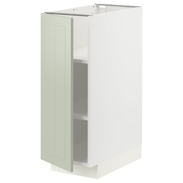 Et hvidt METOD køkkenskab med en grøn stensundslåge. Den er rektangulær med justerbare hylder og et slankt, moderne design.
