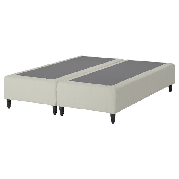 En RENFJÄLLET sengebund i beige med sorte ben med et moderne og stilfuldt design med pocketfjedre for komfort og bevægelsesisolering.