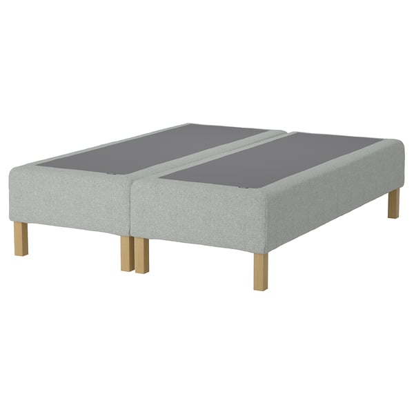 En grå IKEA RENFJÄLLET sengebund med træben.