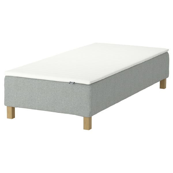 En IKEA RENFJÄLLET madras i hvid med lysegrå bund og træben.