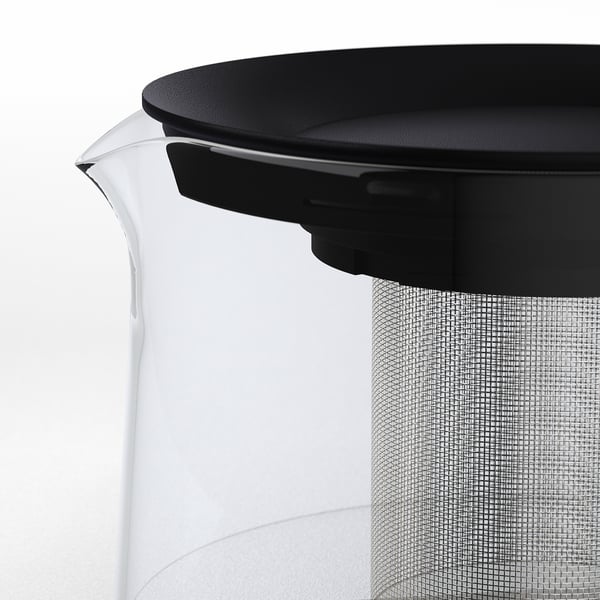 Moderne tekande i glas med sort låg og netfilter, perfekt til brygning af te i løs vægt.