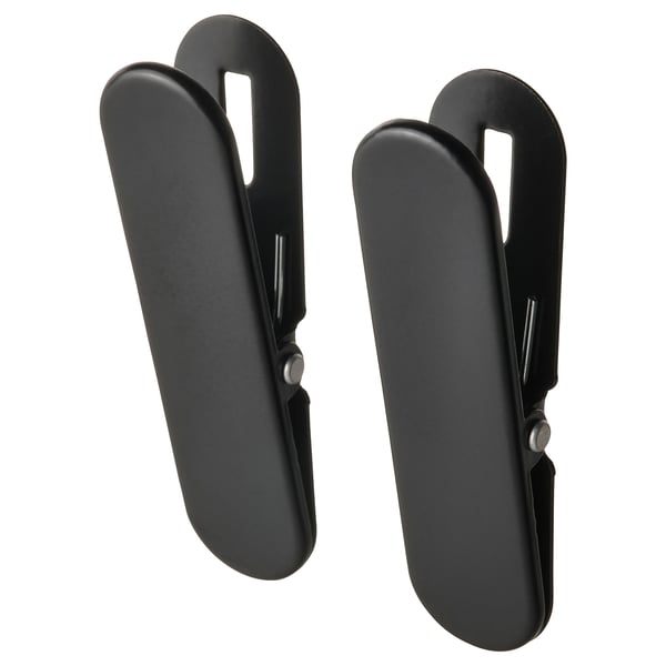 Sorte SKÅDIS fjederclips, par, plast, åbent design.
