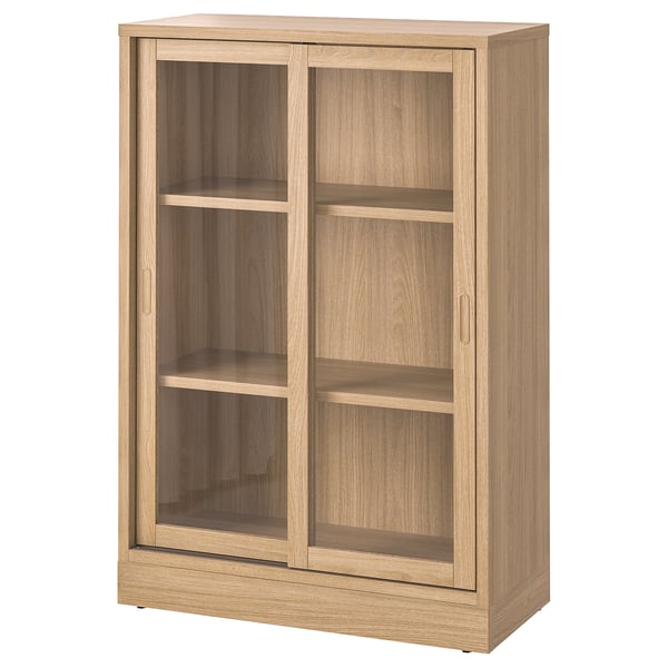 TONSTAD lyst egetræsskab med glasskydelåger, rektangulær form, fire hylder, moderne design.
