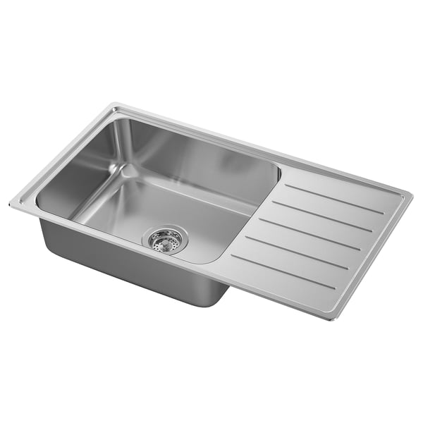 Køkkenvask i rustfrit stål, rektangulær med afløbsbræt til højre. Skinnende, moderne design, elastisk materiale.