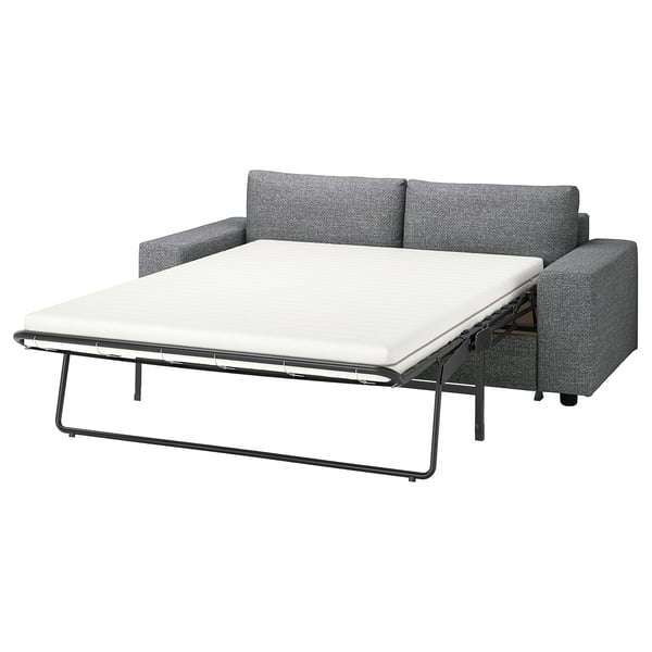 En grå VIMLE sovesofa, designet til nem ombygning til en behagelig seng.