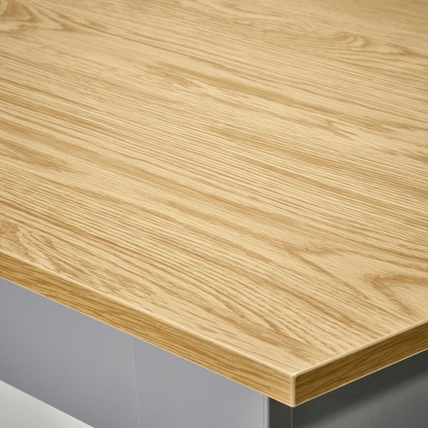 Light wooden tabletop on metal base; smooth finish; clean, sleek edges.