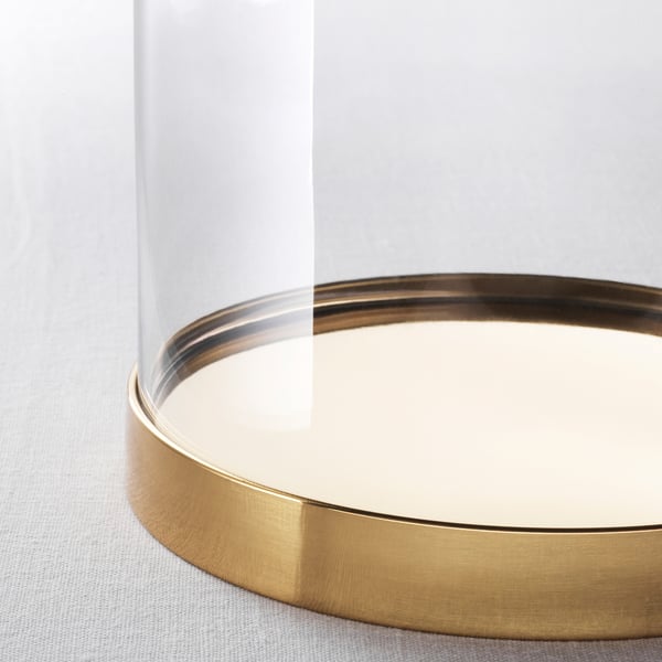 Elegant glass dome with gold base, showcasing high-quality design and craftsmanship.