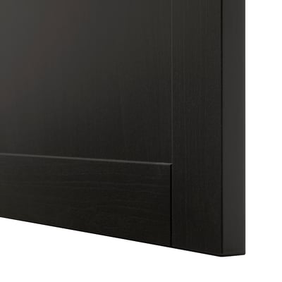 Black wooden furniture corner, showing smooth finish and sturdy joint.