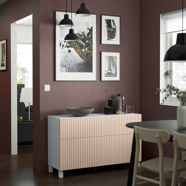 Modern living room with BESTÅ sideboard, photos, and decor.