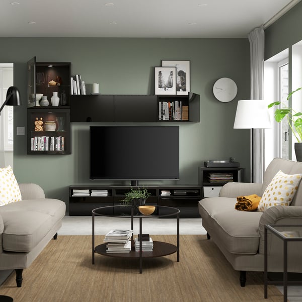 Modern living room with BESTÅ tv unit, adjustable shelves, and flat-screen tv.