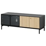 A black and light wood BOASTAD tv bench with glass doors.