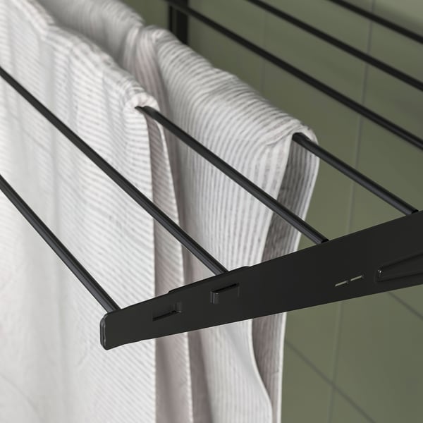 BOAXEL drying rack, sleek black metal design, holds white striped towel.