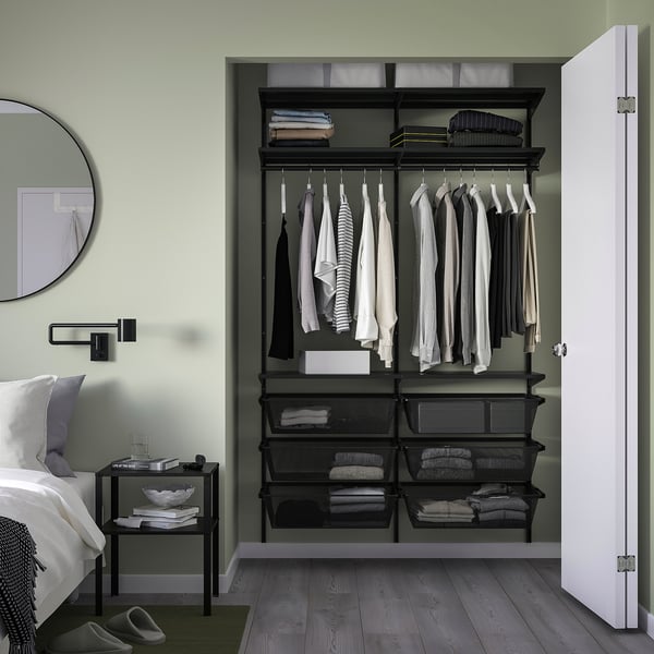 Open closet, BOAXEL by IKEA. Black mesh steel baskets, clothes, hangers. Compact, organised. Half door visible.