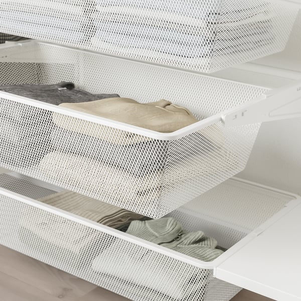 Mesh drawers with folded clothes, part of BOAXEL bedroom/closet storage system.