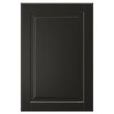 A single black BODBYN cabinet door with a classic bevelled panel design, smooth lacquered finish.
