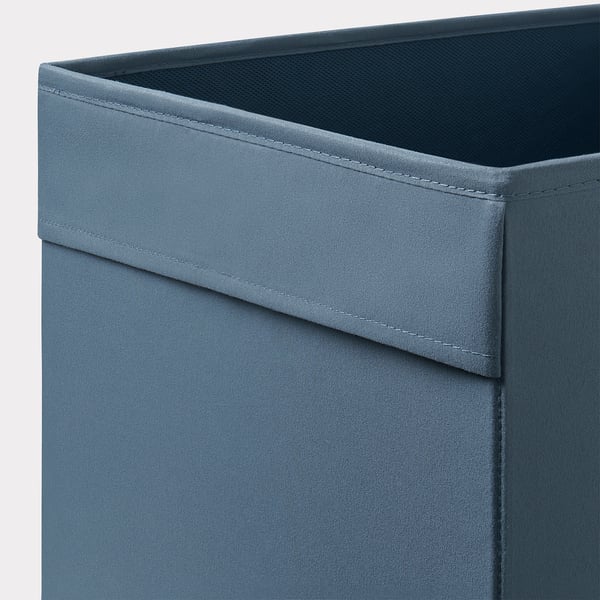 Close-up of a stylish fabric storage bin, showcasing its sturdy seams and quality material.