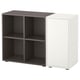 An EKET storage unit in black and white, with compartments and a door.