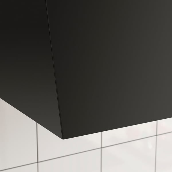 Black modern kitchen hood with sleek design, matt finish, and efficient air-flow systems.