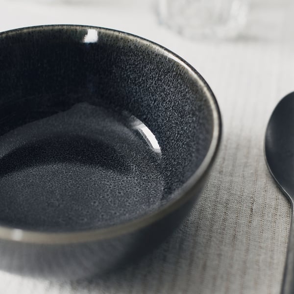 Grey bowl with smooth glaze on cloth.