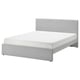 Modern grey upholstered bed with padded headboard, clean lines, and under-bed storage.