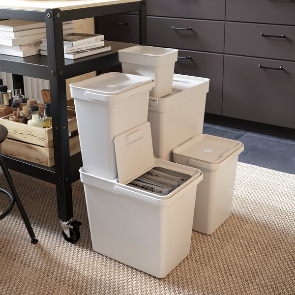 Set of white HÅLLBAR recycling bins, stacked neatly. Perfect for sorting waste at home or office. Made of recycled plastic.