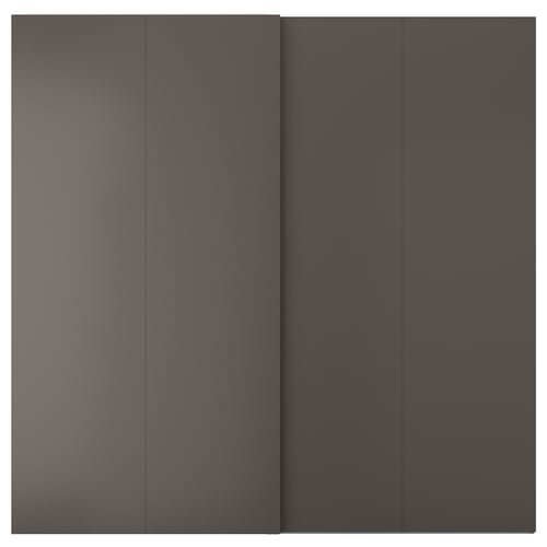 A dark grey HASVIK sliding door, sleek and minimalist, made of abs plastic and fiberboard, matching pax frames perfectly.