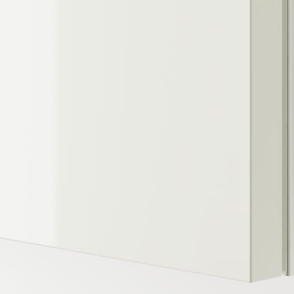 Close-up of glossy white sliding door; modern, sleek design.