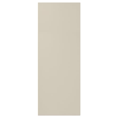 Beige HAVSTORP cabinet door, smooth fiberboard, rectangular.
