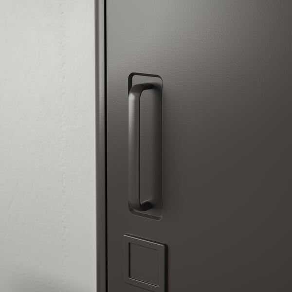 Black drawer handle on textured surface; modern, sleek design.