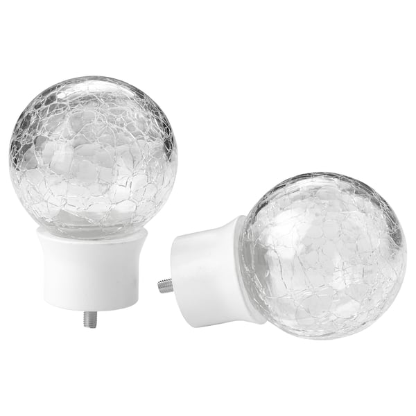 Two white finials with crackled glass spheres, ideal for curtain rods. They have a round shape and a textured glass design.