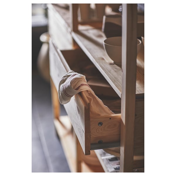 IVAR storage shelves in light beige, made of solid pine wood, with a drawer for organization.