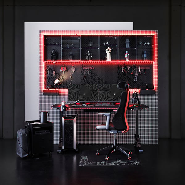 Modern gaming setup with black LÅNESPELARE, red lights, gaming accessories.