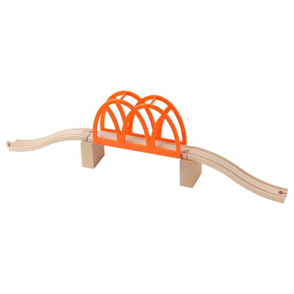 Bright orange toy train bridge. Made of plastic and wooden tracks. Arch design, connects railway systems.