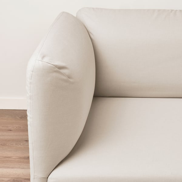 Modern beige sofa, plush cushions, clean lines. Frame and seat look durable, comfy design.