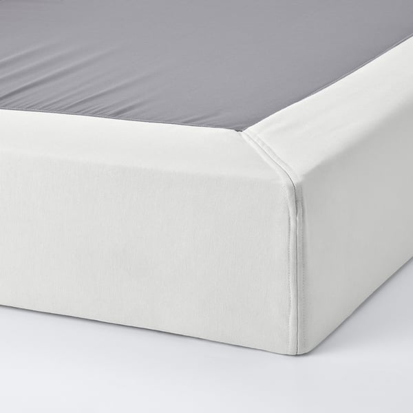 Crisp white bed skirt with neat zip, fits mattress snugly.