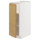 A white METOD kitchen cabinet with a light oak front and integrated handles, featuring a minimalist and warm design.