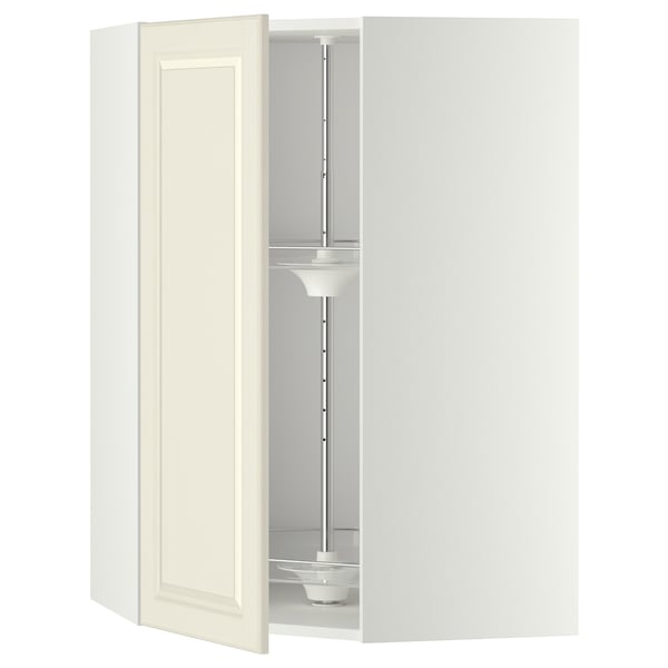 Depicts a white METOD kitchen cabinet with a swinging door in off-white and an internal carousel organiser.
