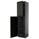 Black kitchen cabinet with open door, modern beveled design, metallic fittings, pull-out shelves.