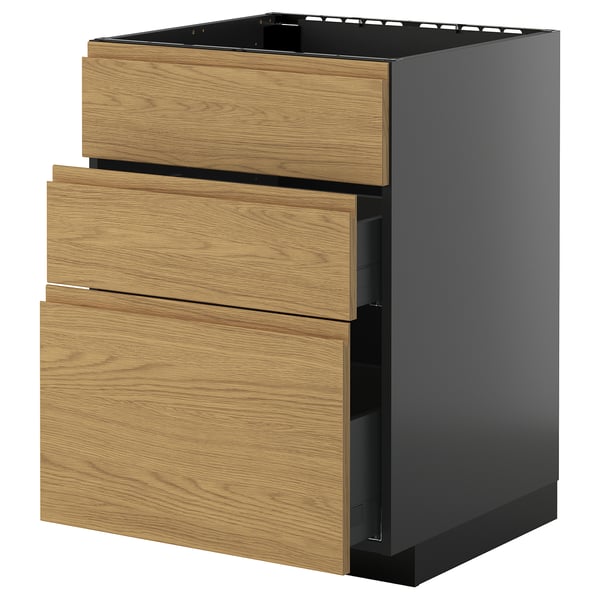 A modern wooden drawer unit, part of the METOD kitchen system with oak effect voxtorp fronts. It three drawers with integrated handles.