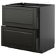 Black METOD kitchen cabinet with glossy finish and beveled edges.