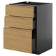 Modern kitchen unit with three wooden drawers in light oak, dark grey body, minimalist style.